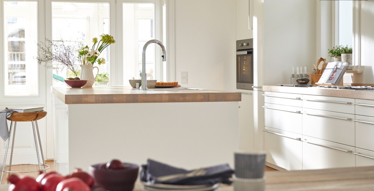 Kitchen Window With Shelves And A Traditional Sink Tap And Running