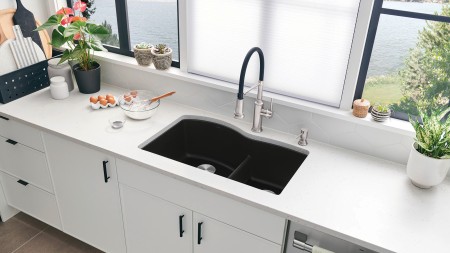 Start with a clean slate by painting the walls white and swapping out dark countertops