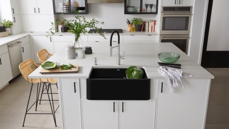 An added feature of modern white kitchen cabinets is that they make the hardware stand out.