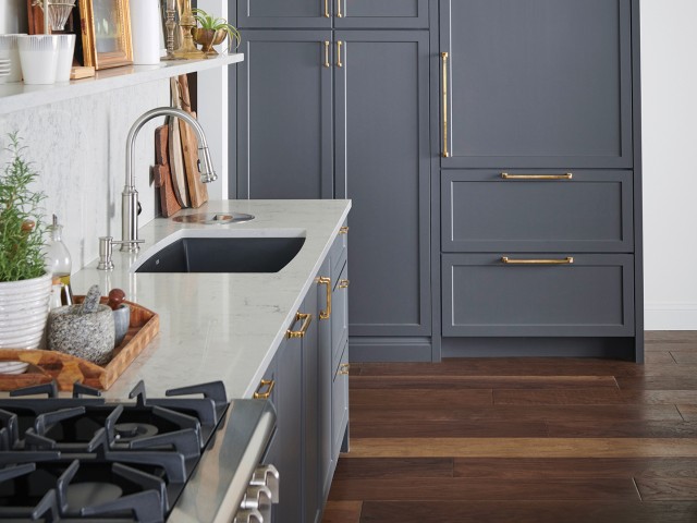 Marble, granite or slate countertops and wood plank floors are common features in transitional kitch