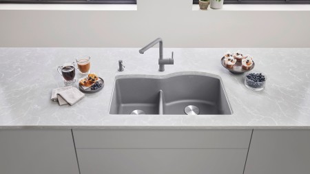 An undermount sink mounts directly to the bottom of the countertop, requiring a strong material