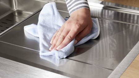 BLANCO stainless steel sink is dried with a microfibre cloth 