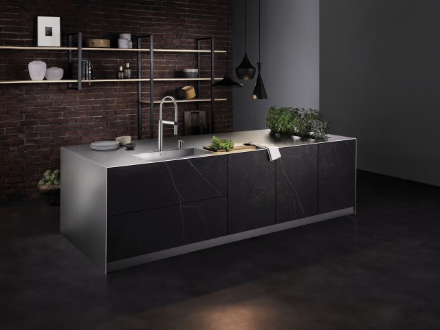 A matt-finish worktop in stainless steel makes a truly eye-catching feature in your open-plan kitchen.