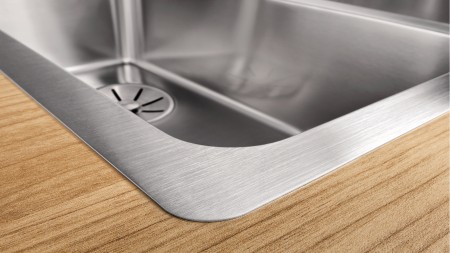 Stainless steel worktop in a wooden interior style
