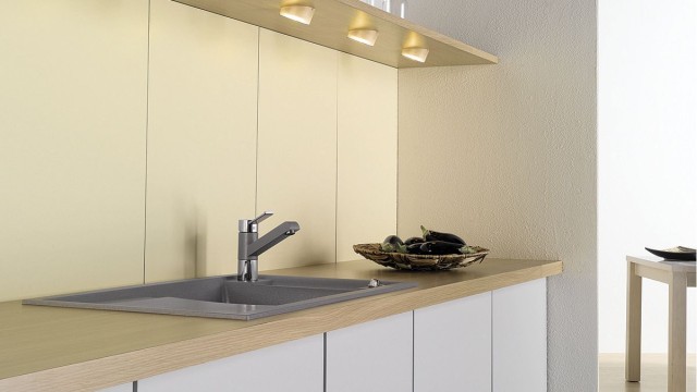Adding lighting to the upper cabinets ensures plenty of light even in small kitchens.
