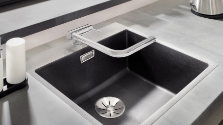 A mixer tap for a window-facing sink